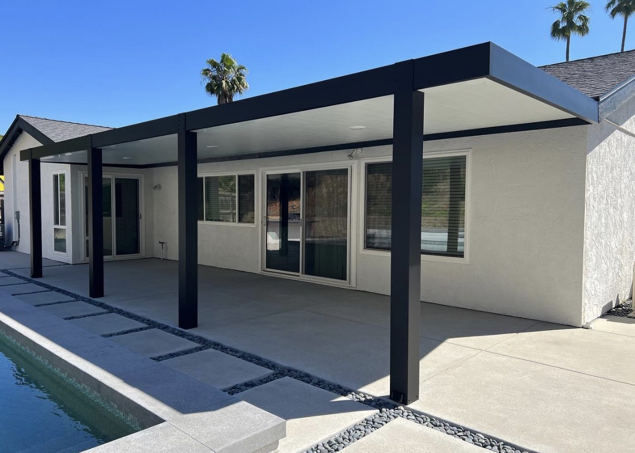 Modern black patio cover beside a swimming pool